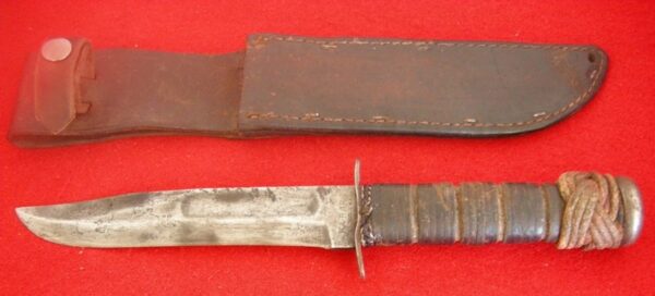 https://leescutlery.com/wp-content/uploads/2021/08/WWII-WW2-USMC-KA-BAR-FIGHTNING-KNIFE-LEATHER-SHEATH2-600x272.jpg